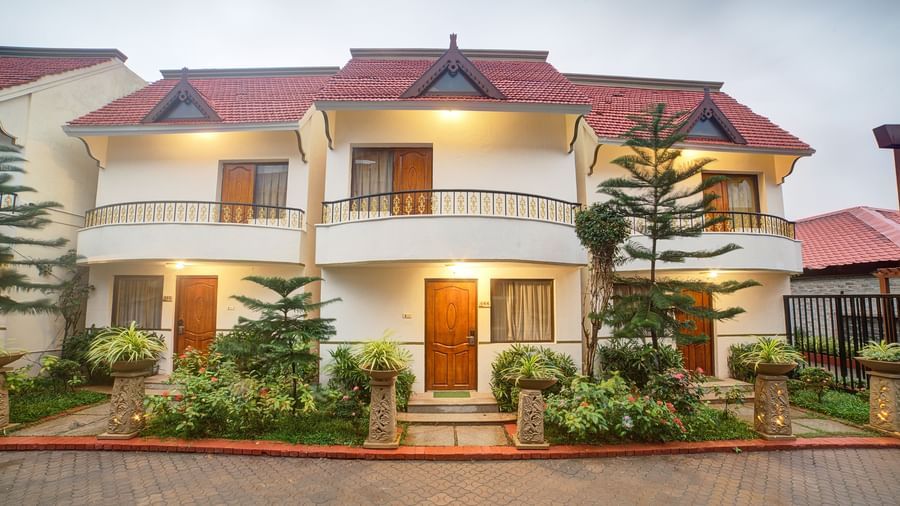 Charming villa-style accommodation surrounded by greenery and paved driveway at Ilara Hotels & Spa, OMR, Chennai