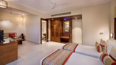 twin beds inside a room at Sea Breeze Sarovar Portico Varca, Goa