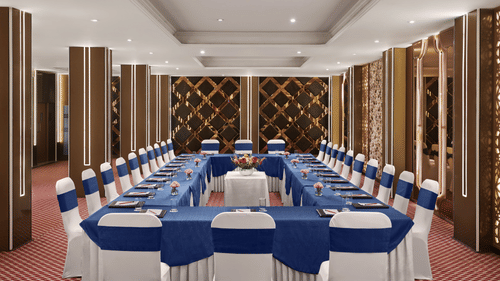 An image of our banquet hall in New Delhi with chairs placed in a U-shape - Deventure Sarovar Portico, Patel Nagar