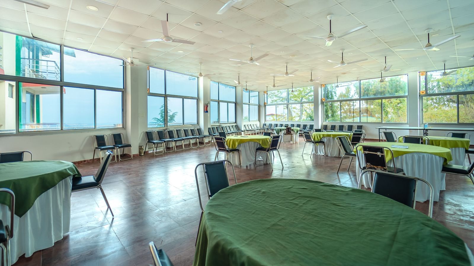round tables placed in the event venue at Flutter Hotels & Resorts
