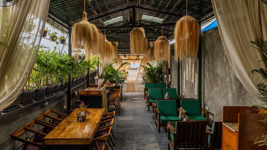 A corridor dining setting at Love Anna Bar and Restaurant with wooden ambience at Royale Amata - By the Beach.