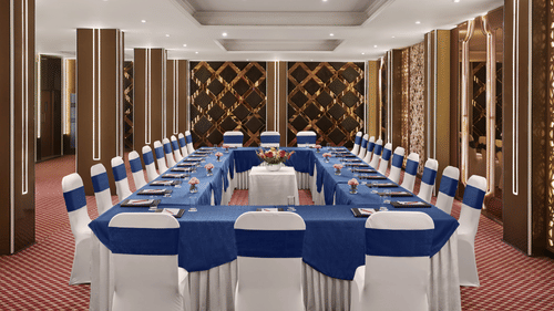 An image of our banquet hall in New Delhi with chairs placed in a U-shape - Deventure Sarovar Portico, Patel Nagar