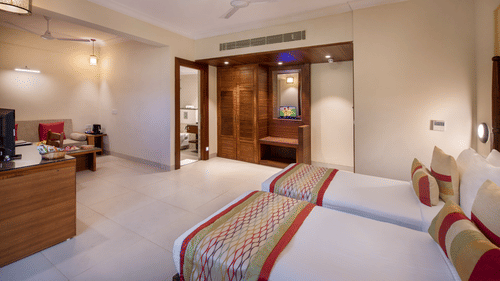 twin beds inside a room at Sea Breeze Sarovar Portico Varca, Goa