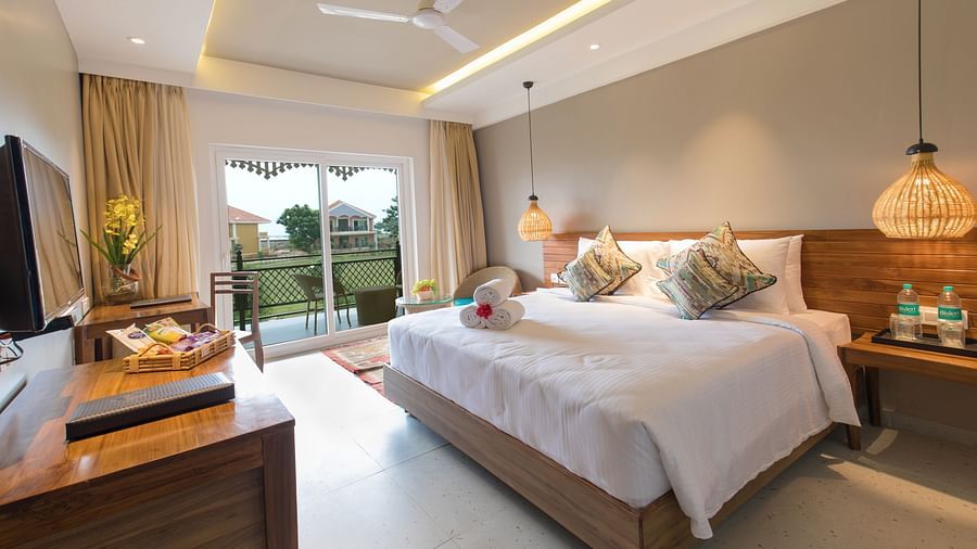 A room at Swosti Chilika Resort with a double bed and a television