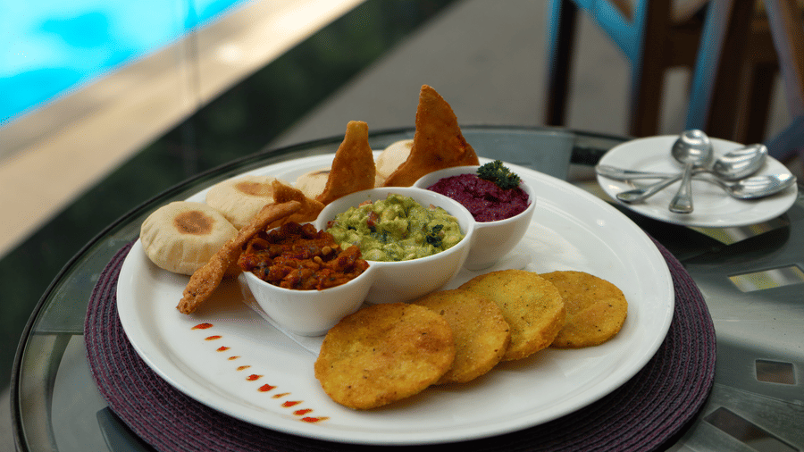 Snack platter served on a poolside table at The Zehneria, Nairobi