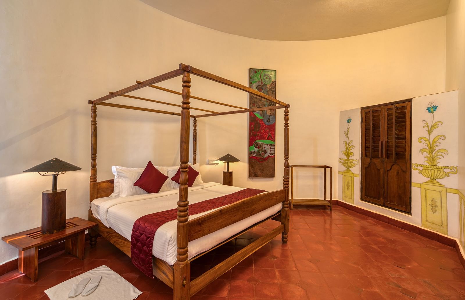 A hotel room with four-pster bed and dim lighting solutions | Mango Hill, Yercaud