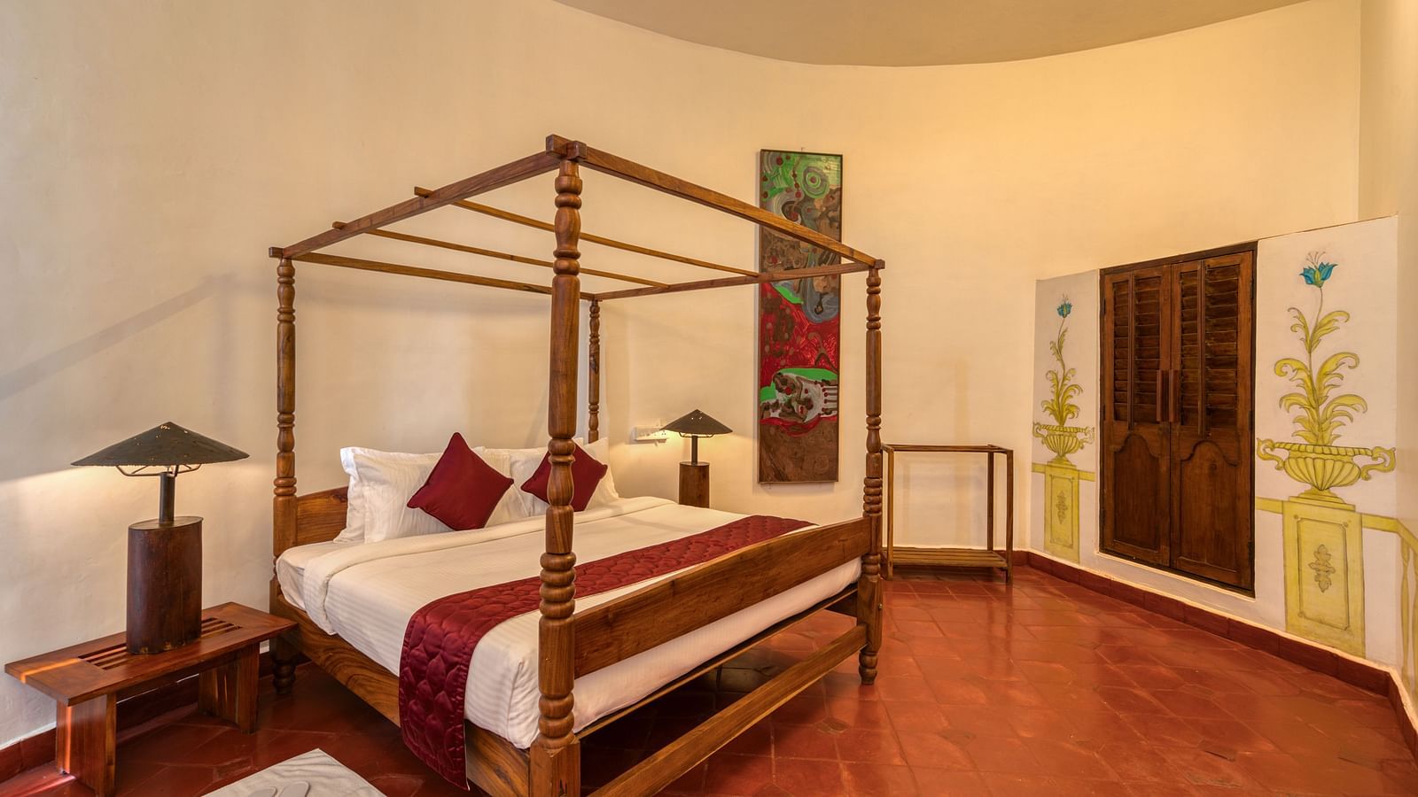A hotel room with four-pster bed and dim lighting solutions | Mango Hill, Yercaud