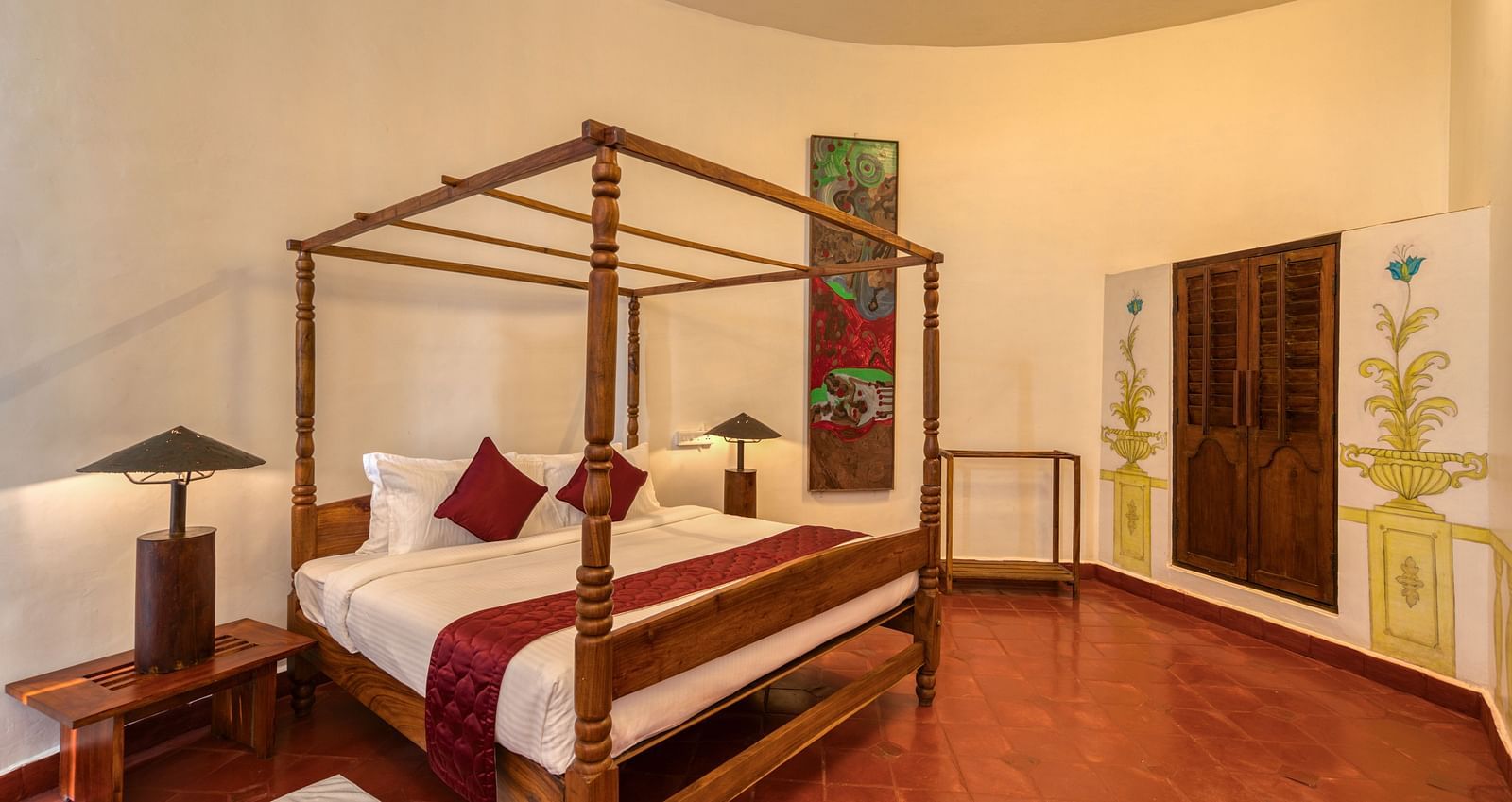 A hotel room with four-pster bed and dim lighting solutions | Mango Hill, Yercaud