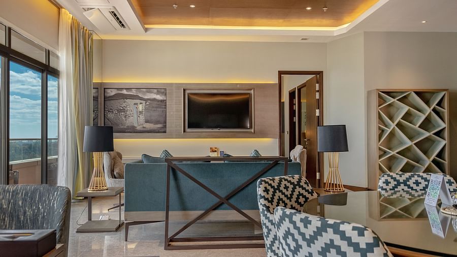 A luxurious living room with elegant interiors at Neelkanth Sarovar Premiere Lusaka