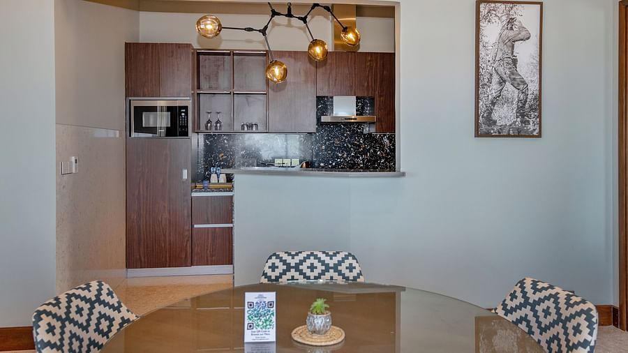 A fully equipped kitchen area with contemporary decor at Neelkanth Sarovar Premiere Lusaka