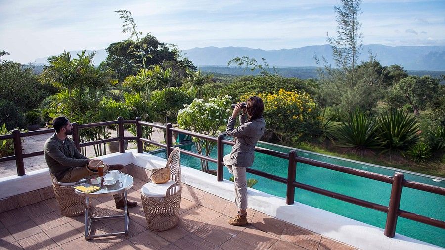 people admiring the view from a deck at our resort in Bandipur