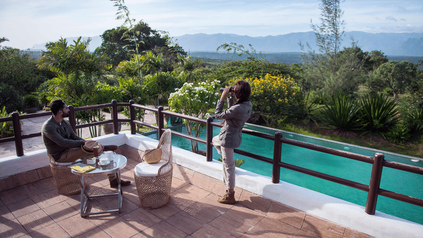 people admiring the view from a deck at our resort in Bandipur