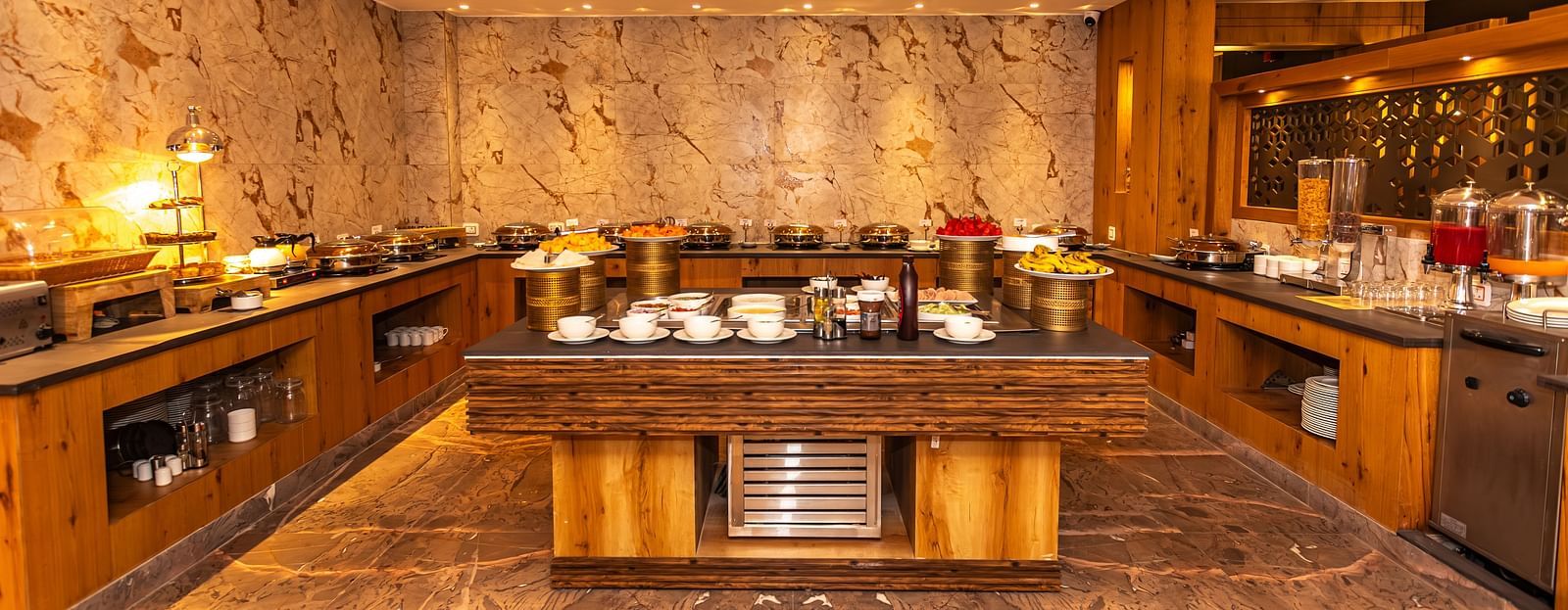 An image of the buffet served at The Belvedere Himalayan Retreat, McLeodganj where tables are laid out with different delicacies and cutlery