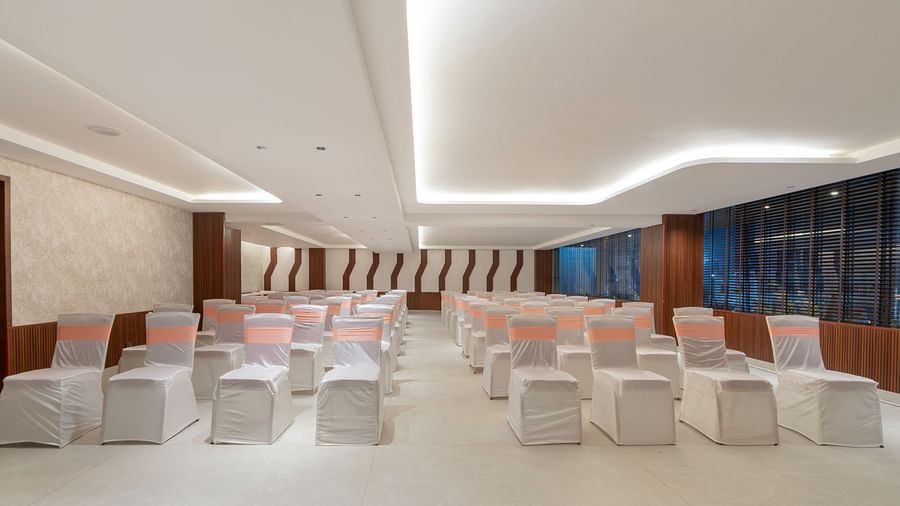 Elegant wedding ceremony setup with floral arrangements.