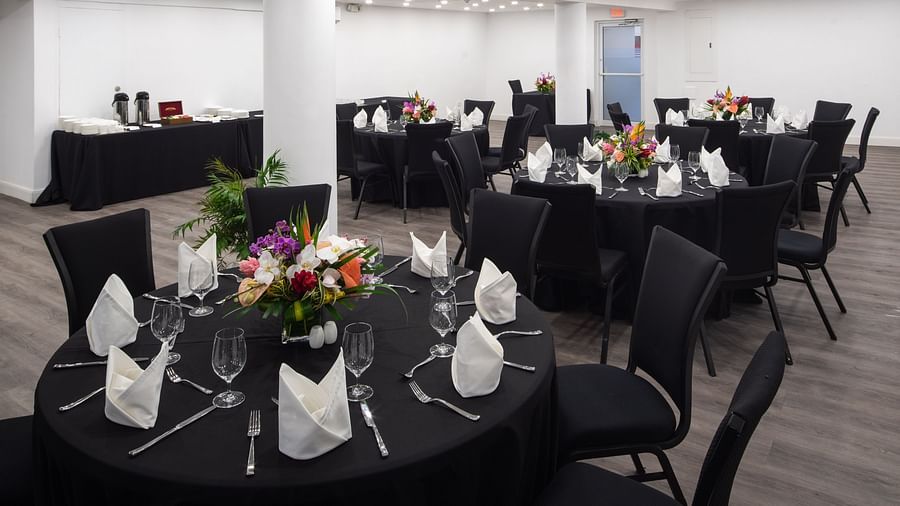 A conference room with round tables and ambient lighting - S Hotel Montego Bay, Jamaica