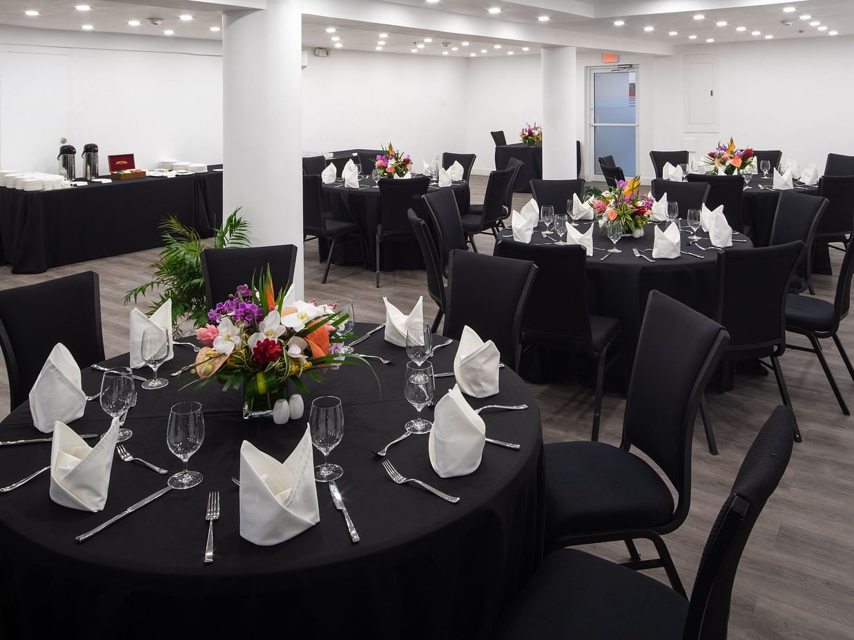 A conference room with round tables and ambient lighting - S Hotel Montego Bay, Jamaica