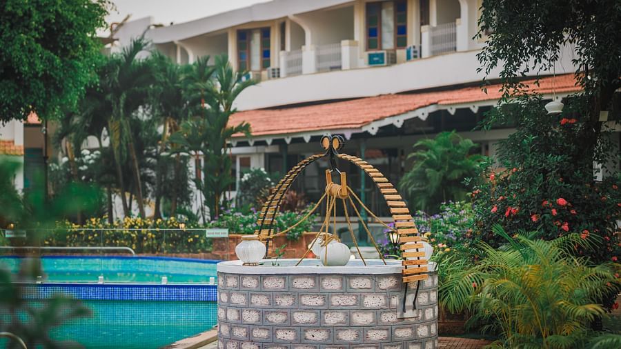 a decorated well near the swimming pool