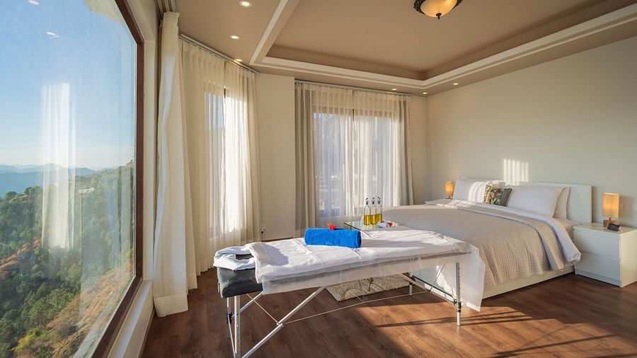 The Manor SHimla - A massage bed and massage oils arranged in our hotel room