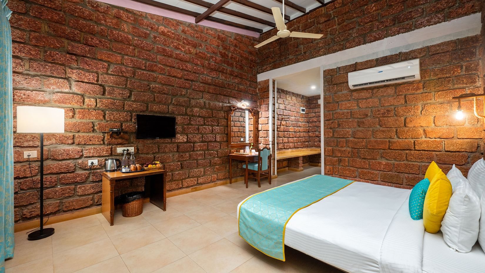 Lotus eco beach resort, room view with tv and bed at Sea Breeze Suite in dapoli one of the best accommodations in murud, dapoli