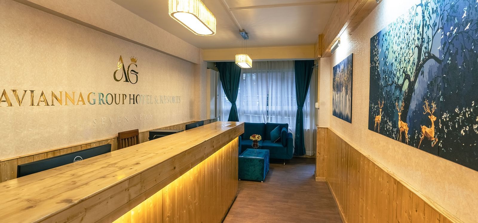 Reception with wooden desk and long hall way at Avianna Seven Seas, Darjeeling