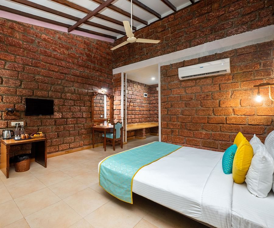 Lotus eco beach resort, room view with tv and bed at Sea Breeze Suite
