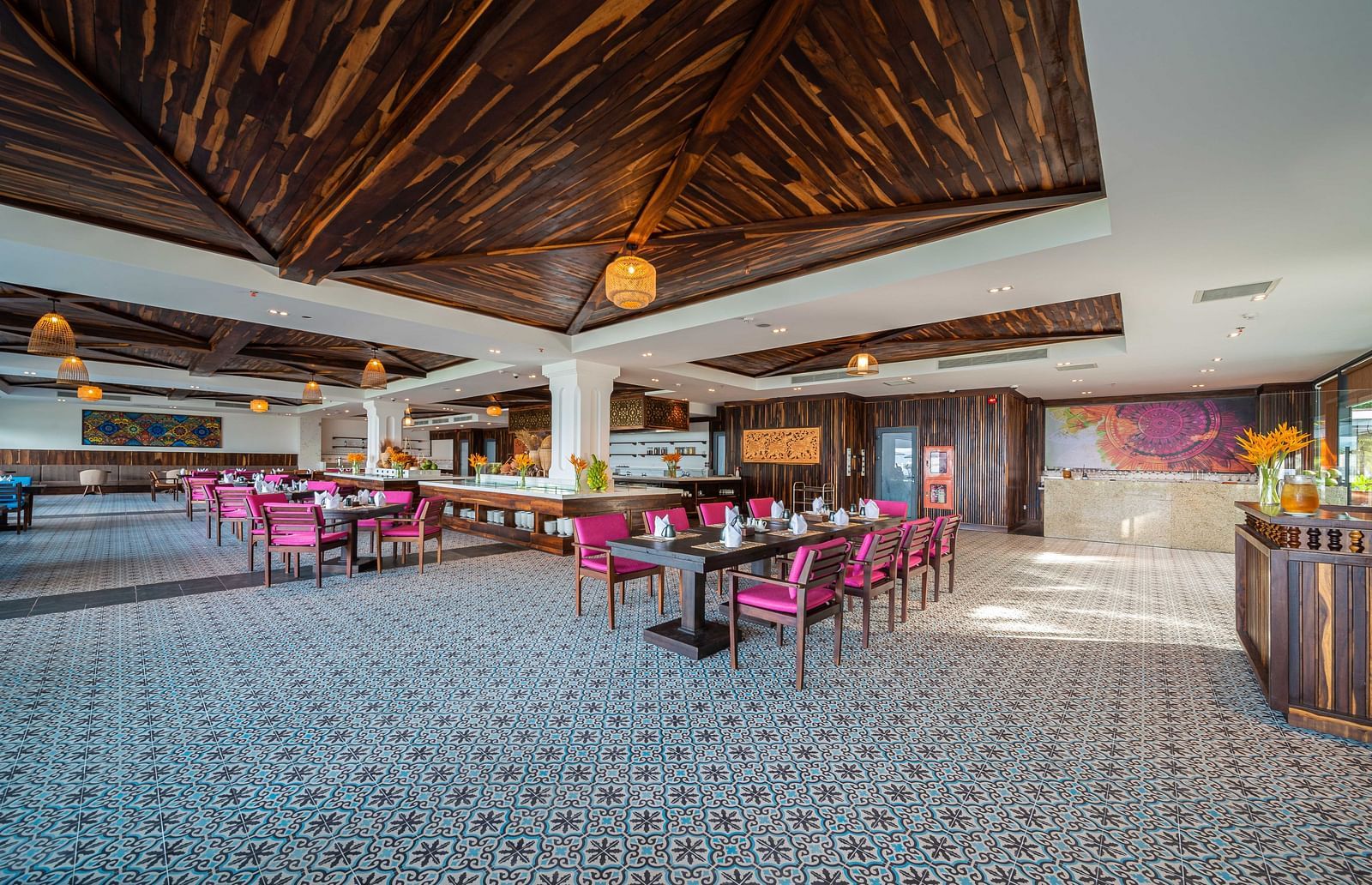 A restaurant with a wooden ceiling, comfortable seating arrangement and lamps hanging from the ceiling - Alibu Resort Nha Trang