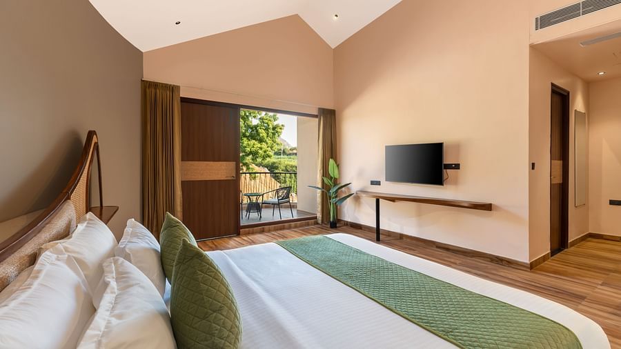 Luxury Villa with Sitout with a king size bed, TV, and view of the outdoors at The Qualia Resort Club & Brewery, Udaipur.