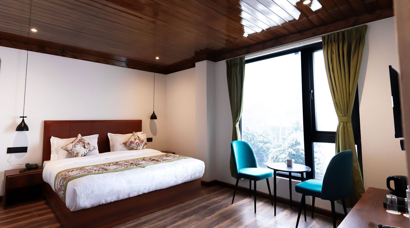 view of the premium room with large bed at Mystique Valley Resort  