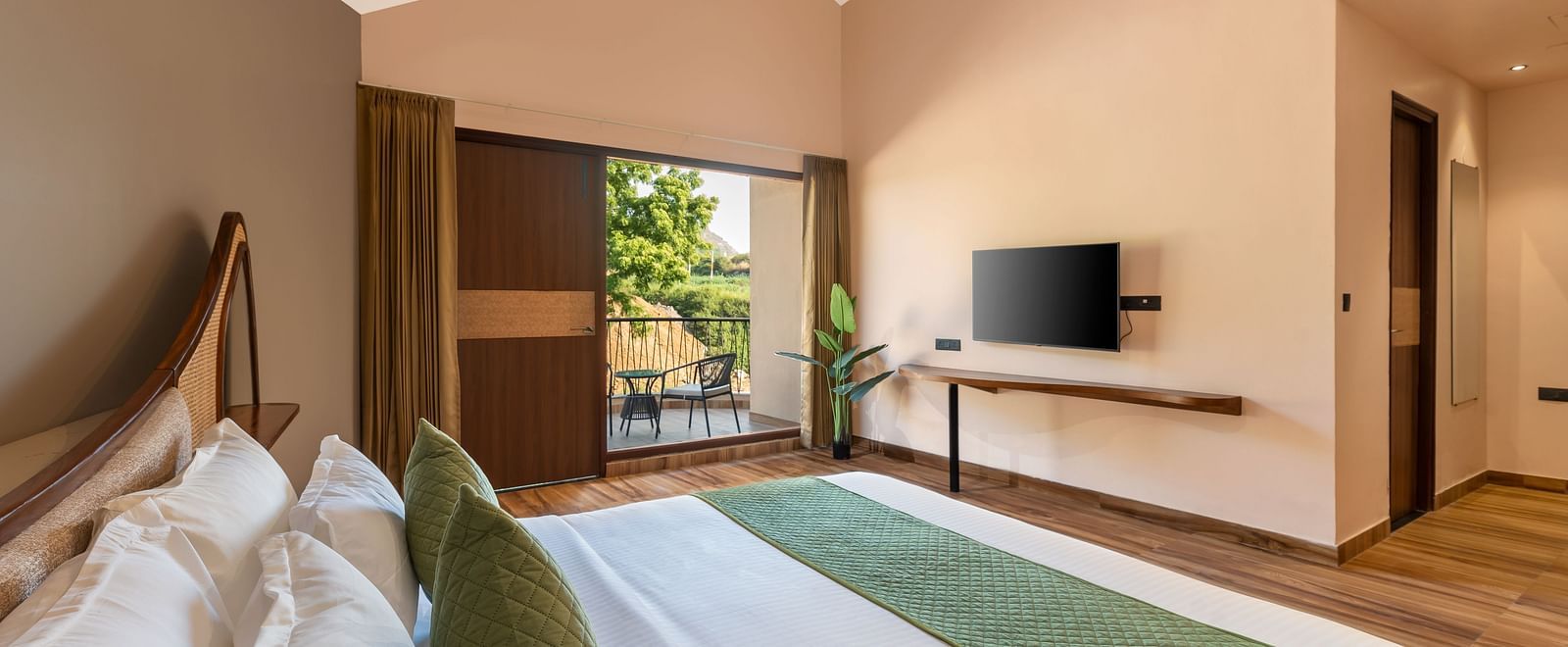 Luxury Villa with Sitout with a king size bed, TV, and view of the outdoors at The Qualia Resort Club & Brewery, Udaipur.