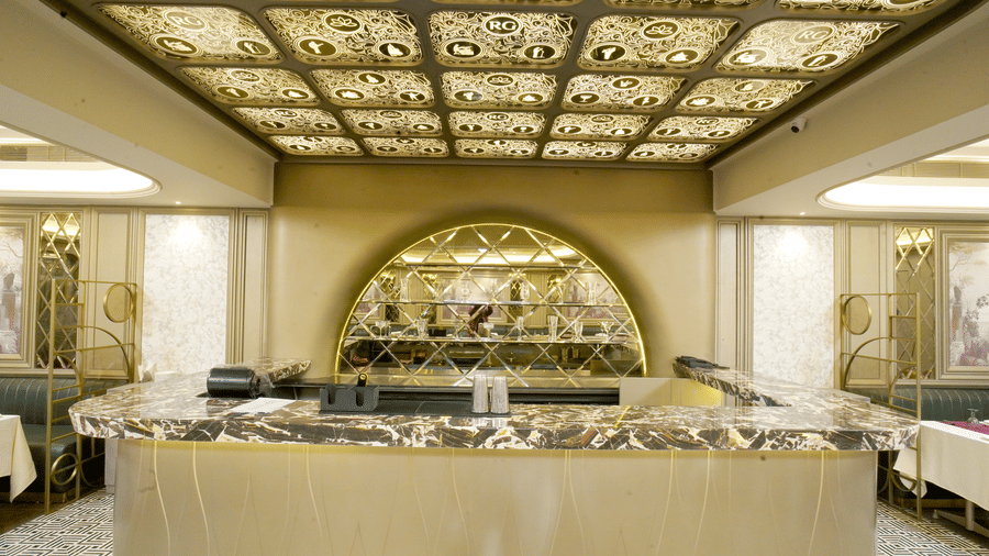 Bar of Nirvana Gateway featuring chic design, marble countertop, and ample lighting and space.