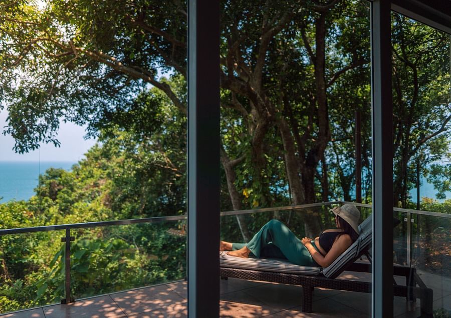 a woman relaxing in the private balcony at cintacor