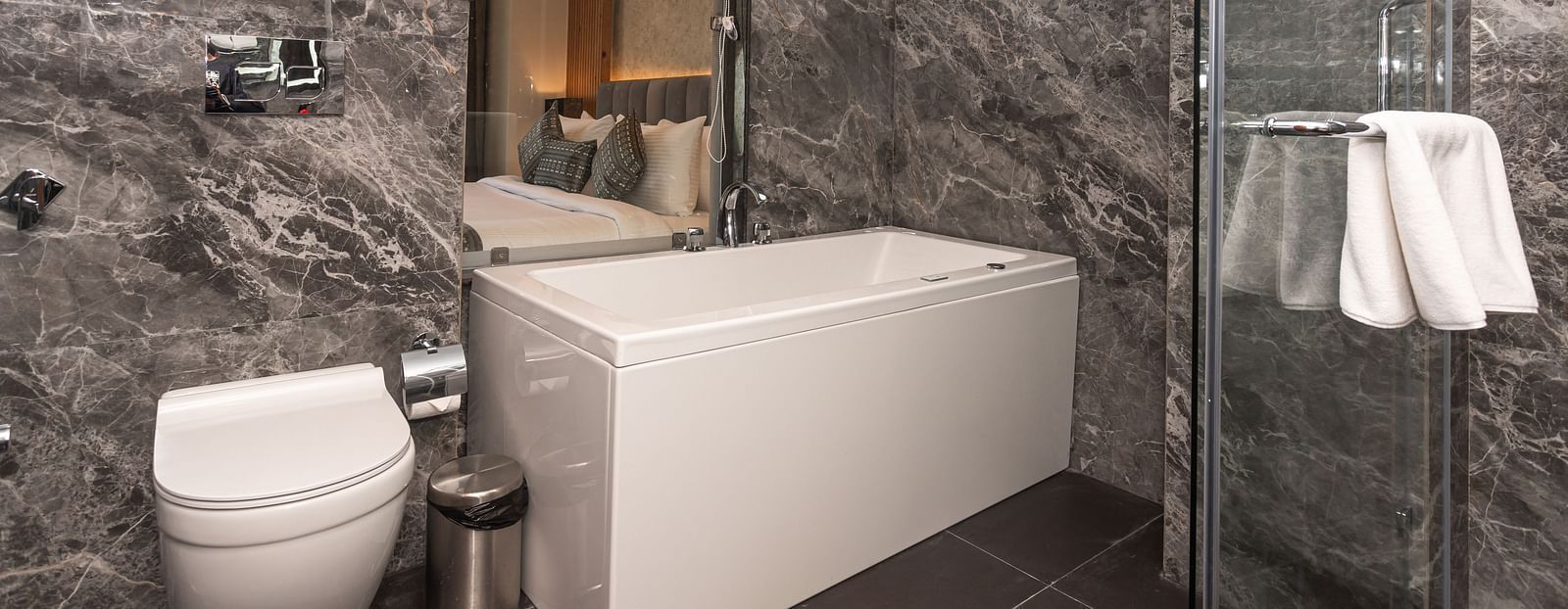 An image of a Washroom in the Suite with a bathtub, shower area and toiletries - The Belvedere Himalayan Retreat, McLeodganj
