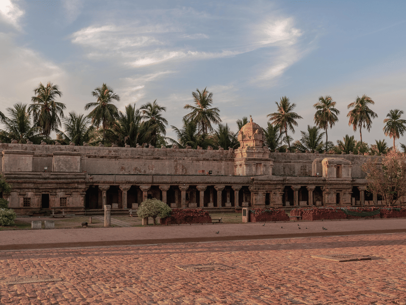 Historic Chola-era Brihadeeswarar Temple featuring grand stone architecture and open courtyards.