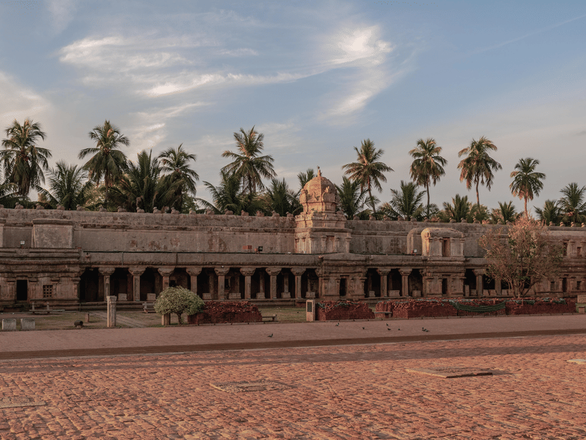 Historic Chola-era Brihadeeswarar Temple featuring grand stone architecture and open courtyards.