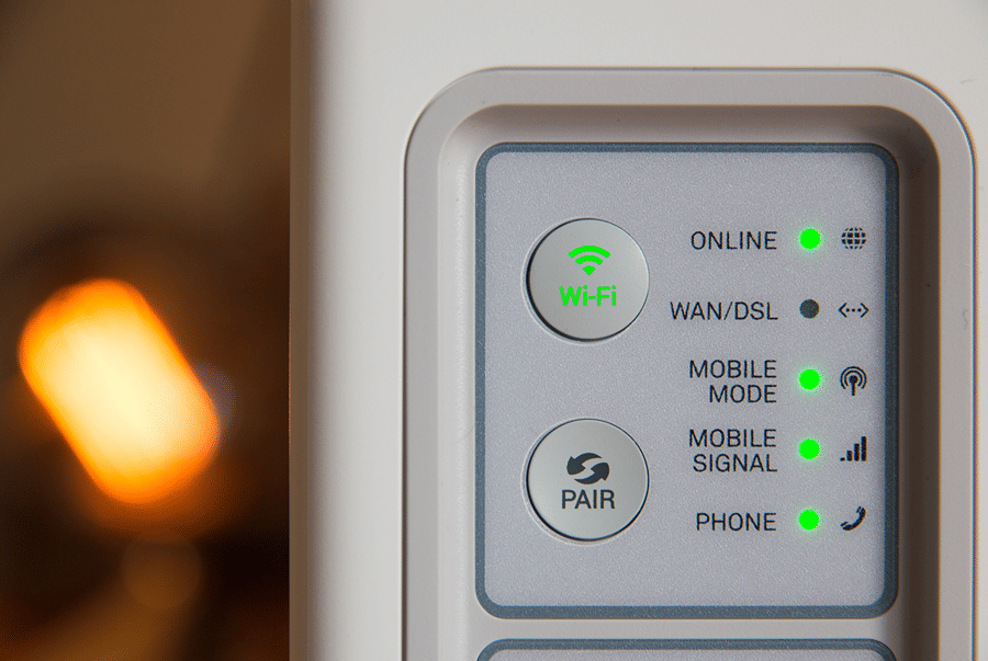 Wi-Fi router with green status lights