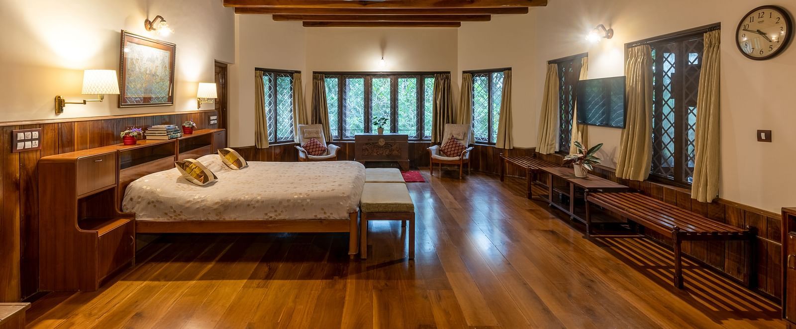 Spacious room with twin beds, wooden floors, and a distinctive wooden ceiling - BluSalzz Collection - Tranquil Resort, Wayanad