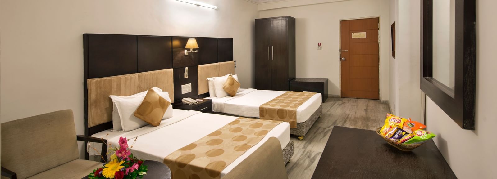 Well-appointed twin room at Lords Eco Inn Dahej with minimalist design and thoughtful amenities.