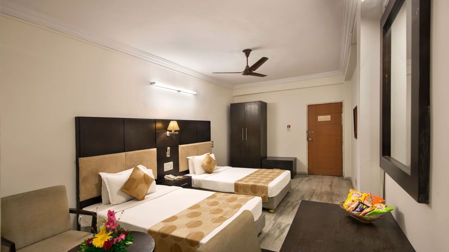 Well-appointed twin room at Lords Eco Inn Dahej with minimalist design and thoughtful amenities.