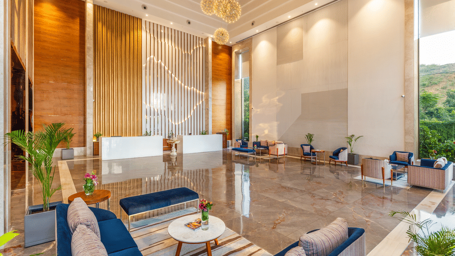 The reception area at Pushkara Resort & Spa featuring seating areas and reception desk.