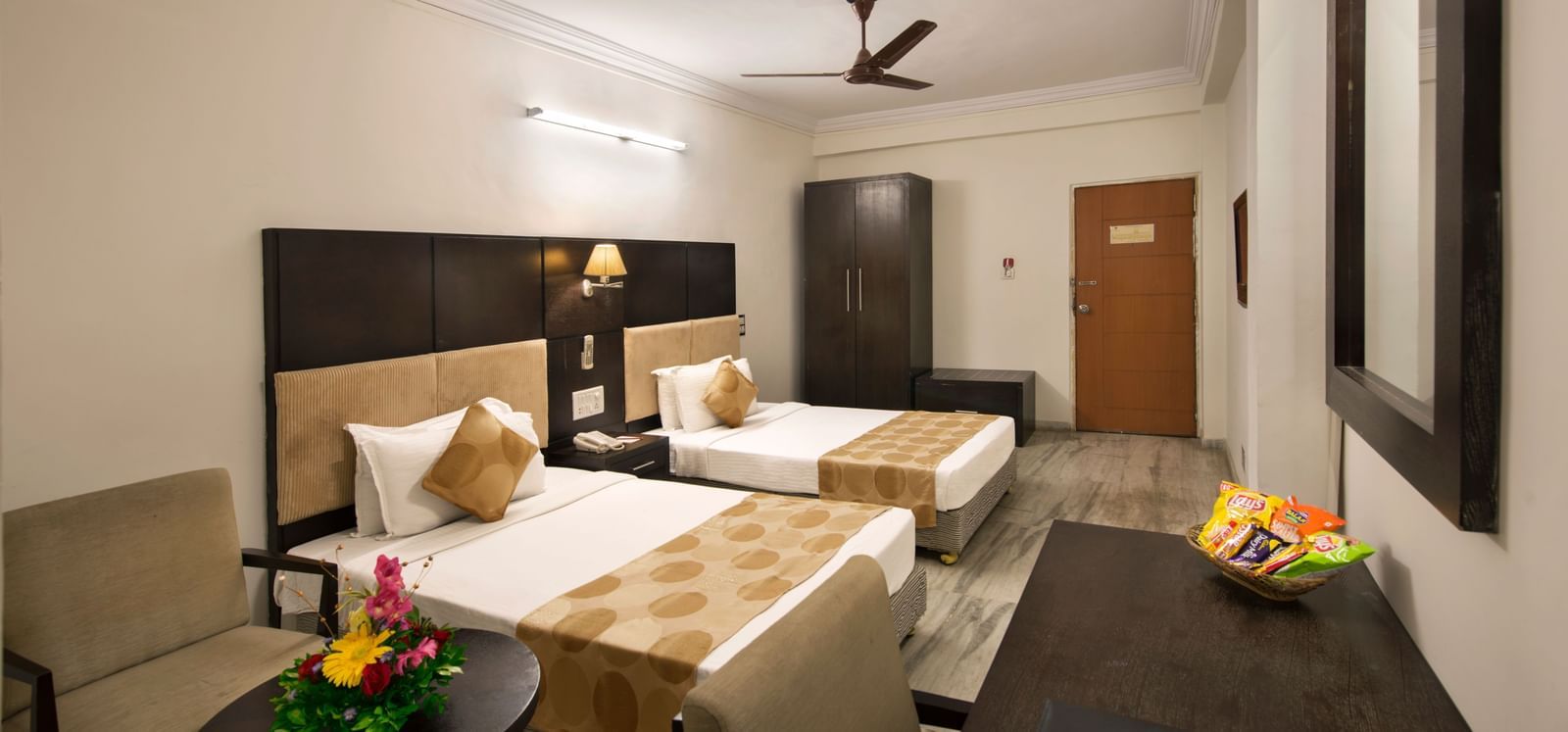Well-appointed twin room at Lords Eco Inn Dahej with minimalist design and thoughtful amenities.