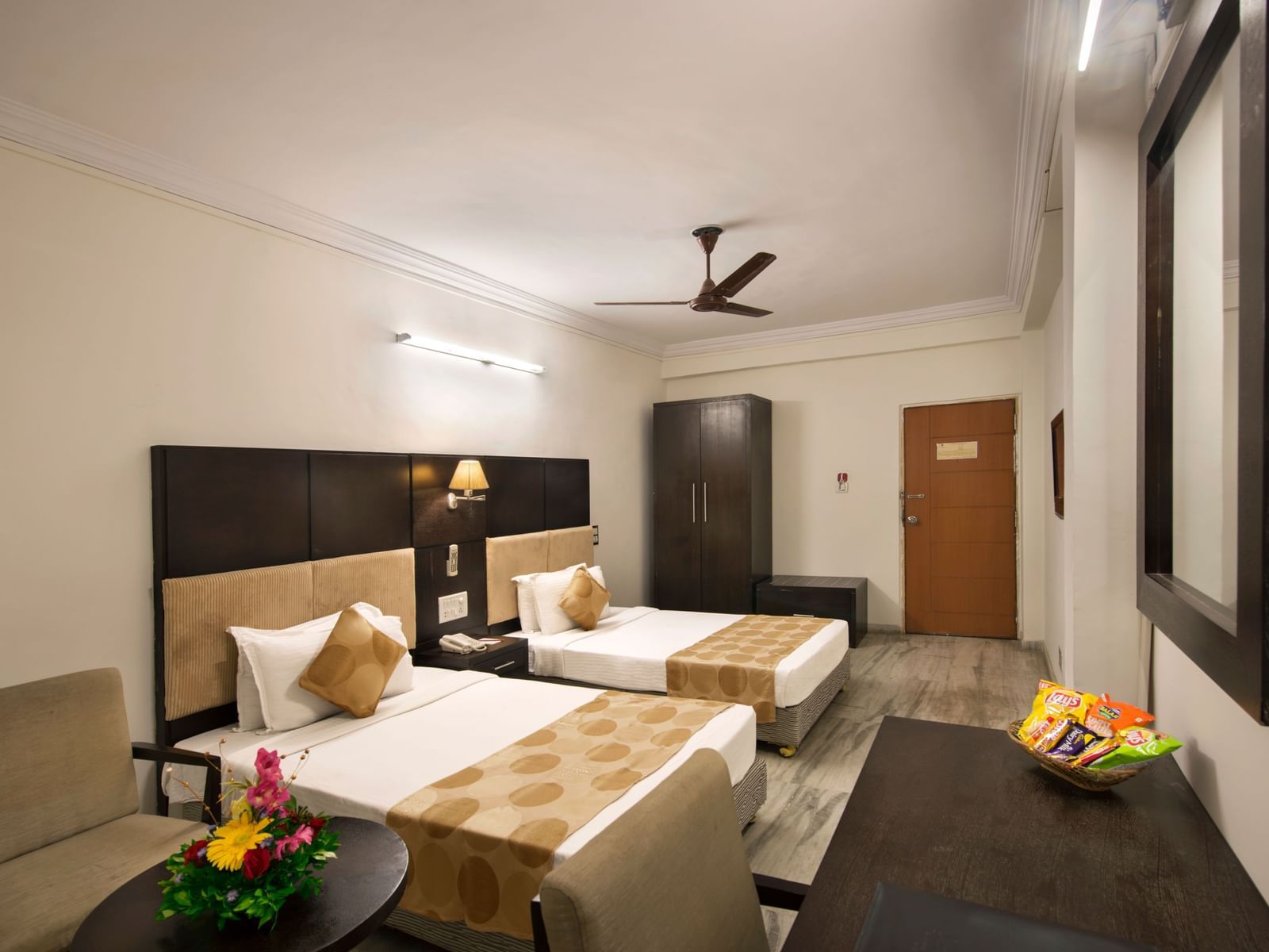 Well-appointed twin room at Lords Eco Inn Dahej with minimalist design and thoughtful amenities.