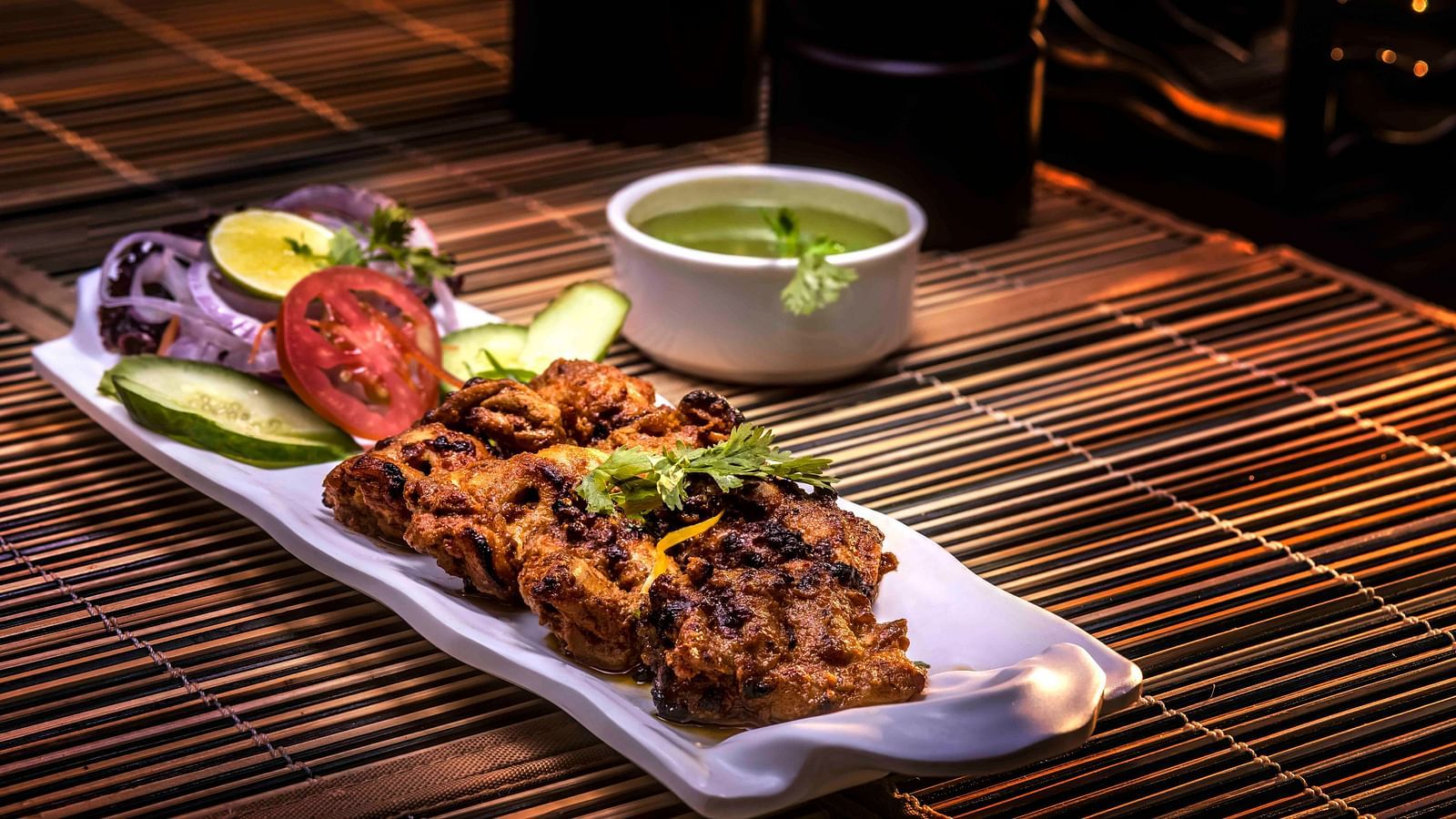 Image of a plate filled with food kept on the table.
