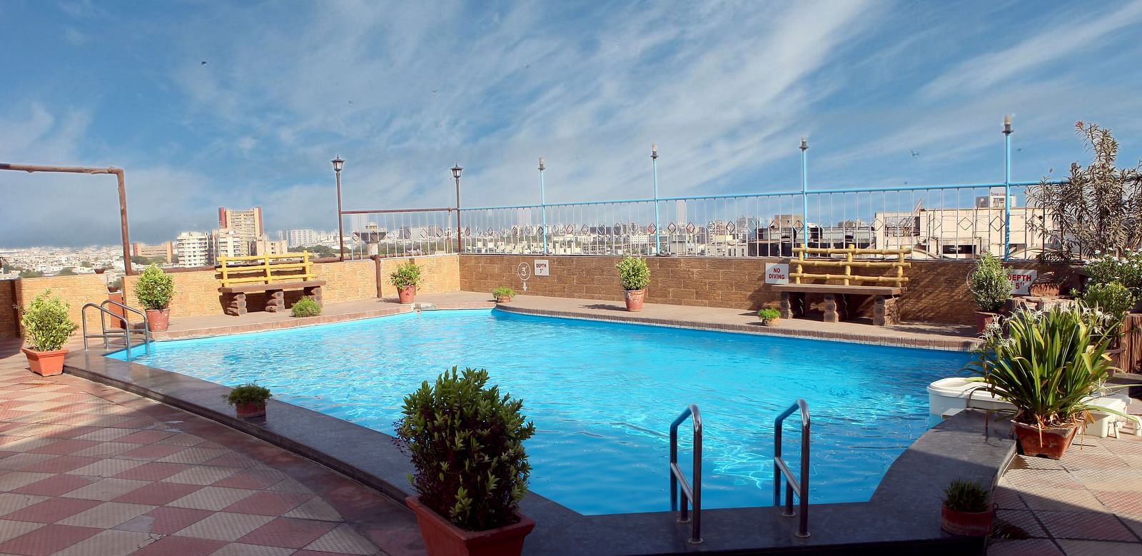 A rooftop swimming pool with city views is available at Lords Plaza Surat.