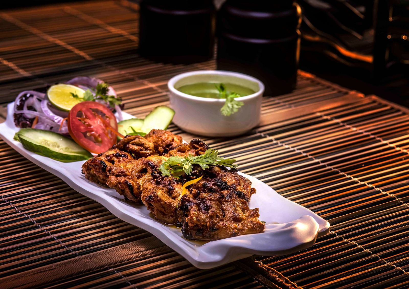 Image of a plate filled with food kept on the table.