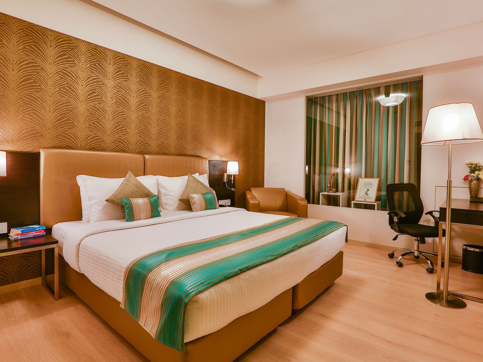 A room with a double bed and a work desk and chair at T24 Residency, Andheri East, Mumbai