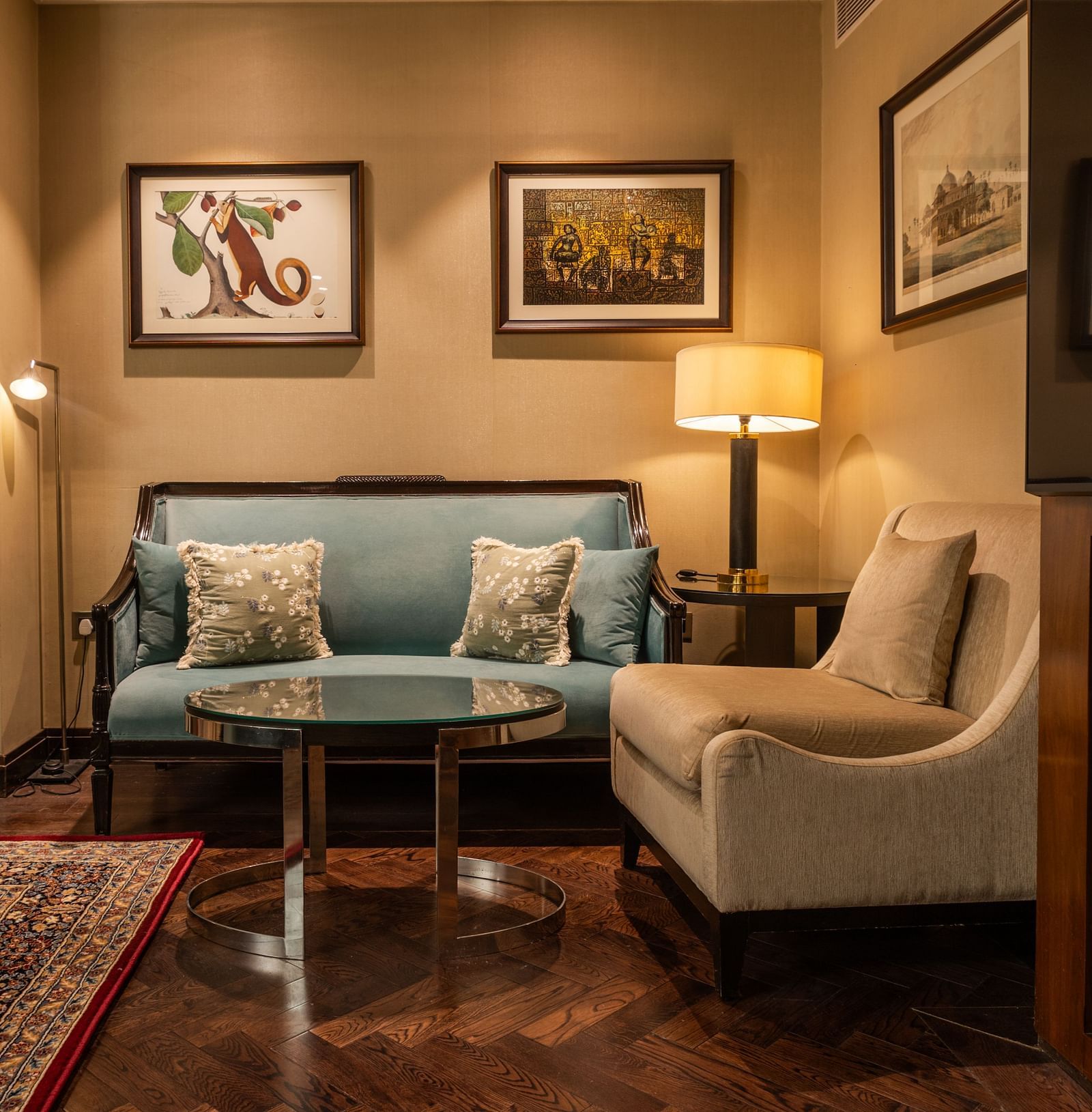 Luxury King Bed Room at The Claridges New Delhi, featuring a cosy sofa seating and a standing lamp in the corner