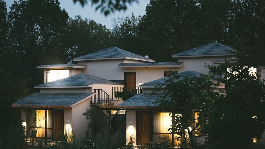 Exterior of the villas at Saraca Resort & Spa Corbett during night time