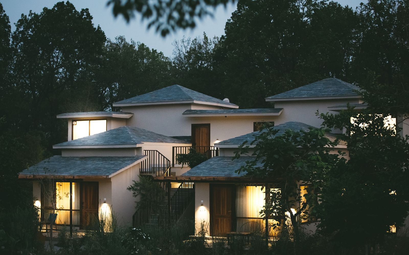 Exterior of the villas at Saraca Resort & Spa Corbett during night time
