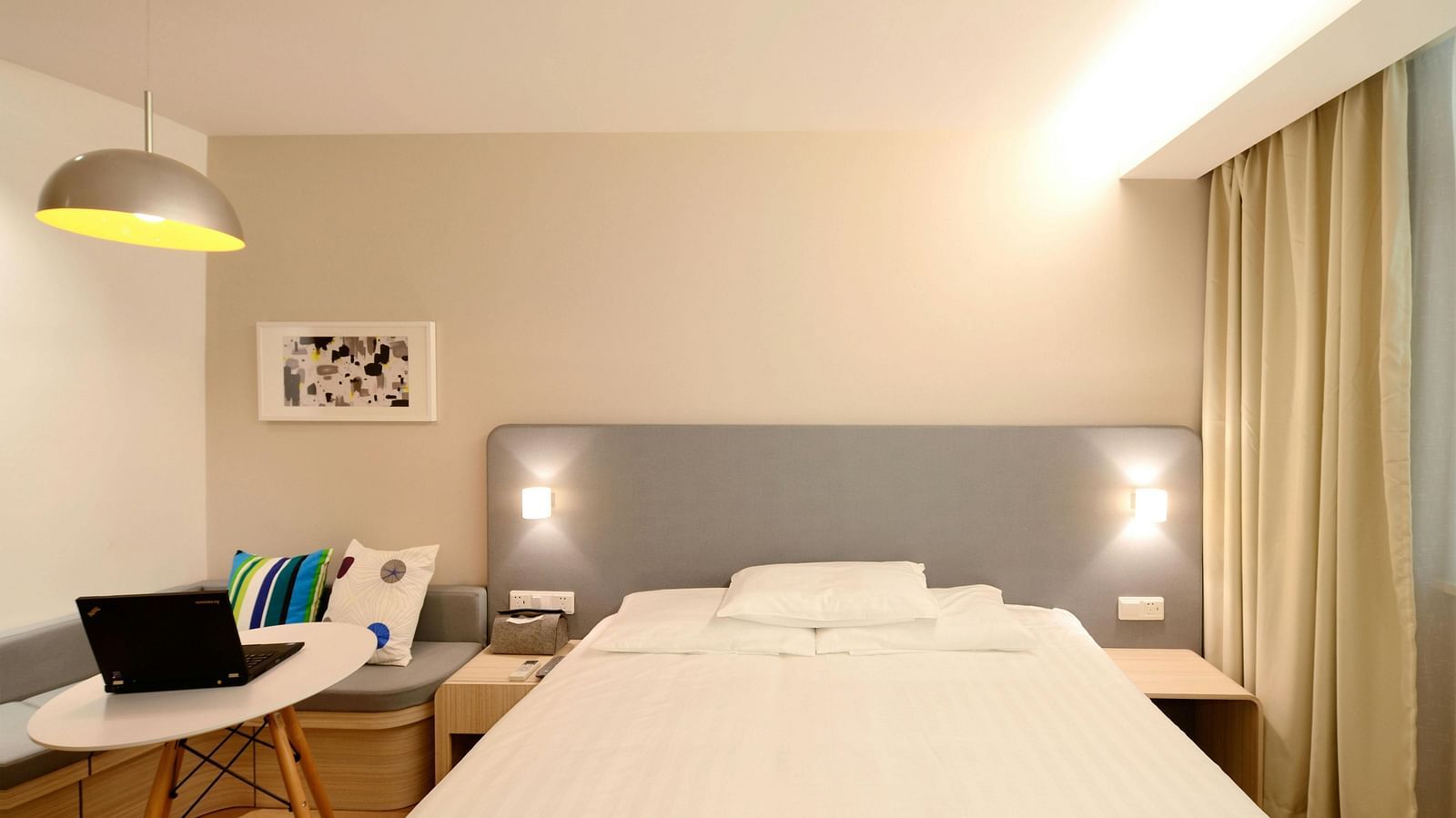 Front view of a double bed in a hotel room