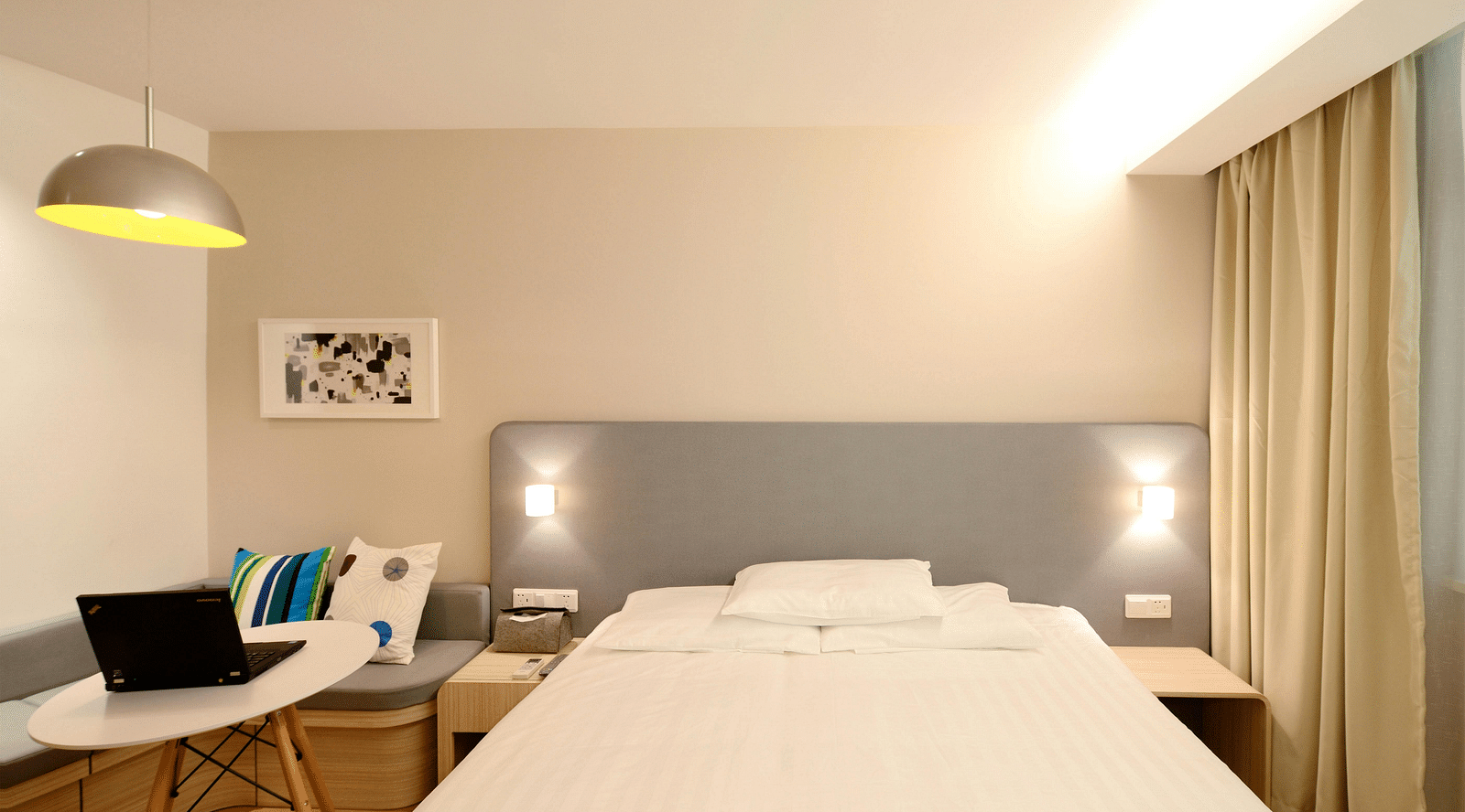 Front view of a double bed in a hotel room